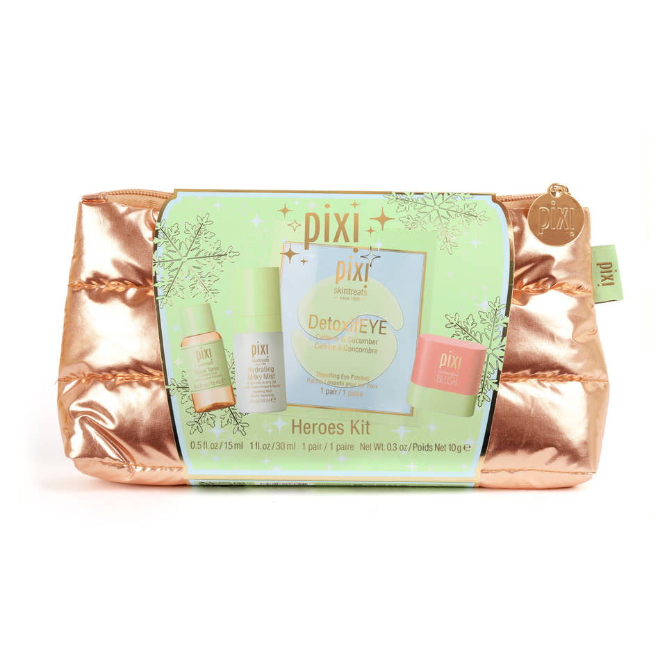 Pixi Heroes Kit makeup set in a metallic rose gold puffer pouch, featuring a green product insert card with images of the included items. view 2
