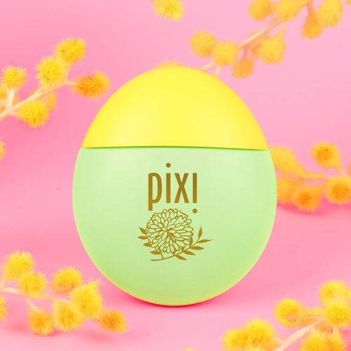 HandHero in PixiMimosa scent shown on a pink background with mimosa blooms view 1