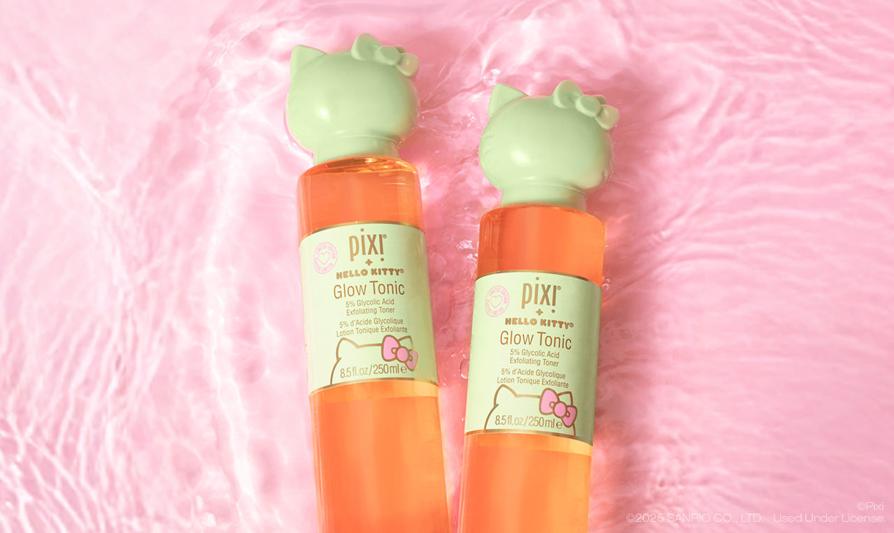 Two bottles of Pixi + Hello Kitty Glow Tonic on a pink water background