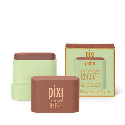 Pixi Petra On-the-Glow Bronze tinted moisturizer shown with its brown and pale green stick container, front cap, and retail box on a white background. view 1