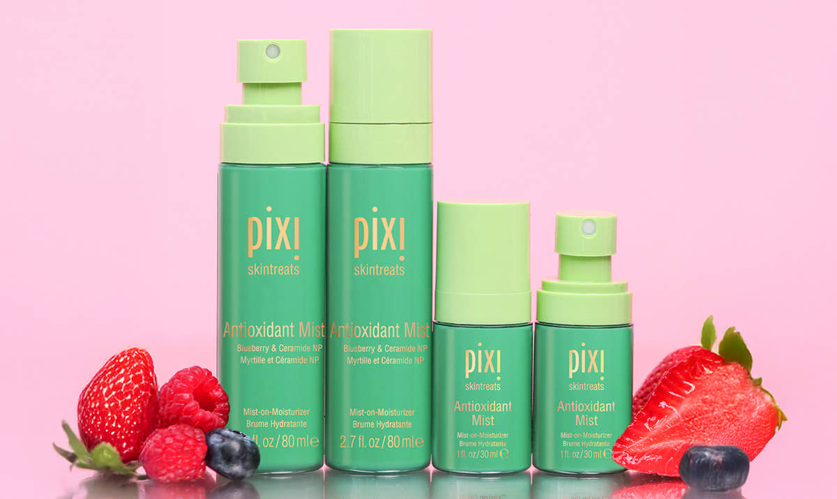 Antioxidant Mists in multiple sizes shown on a pink background with berries - view 2