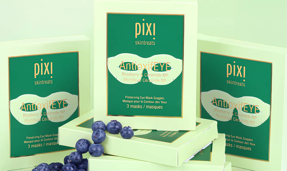 AntioxifEYE Eye Mask Goggles shown on a green background with blueberries