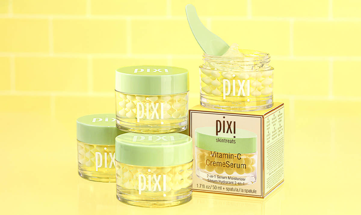 Multiple bottles of Vitamin-C CremeSerum shown on a yellow background