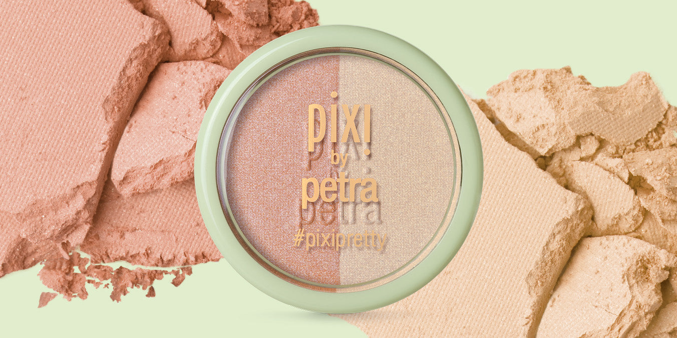 Beauty Blush Duo Mini on a green background with crushed texture of product