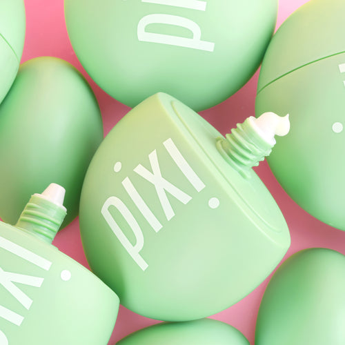 Green PIXI skincare product HandHero showing texture on a pink background view 2
