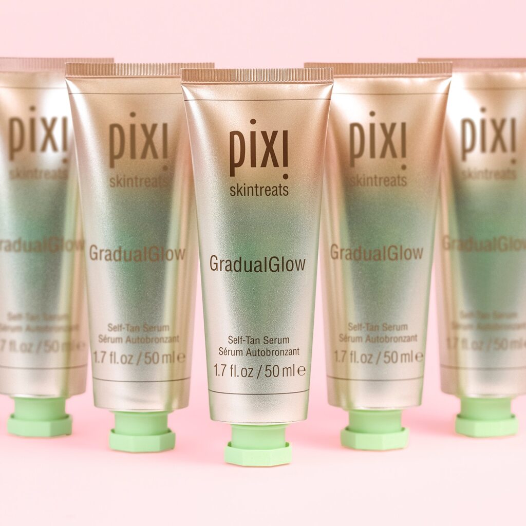 Pixi Gradual Glow skincare products on a pink background