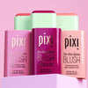 Three PIXI On-the-Glow Blush products on a pink background