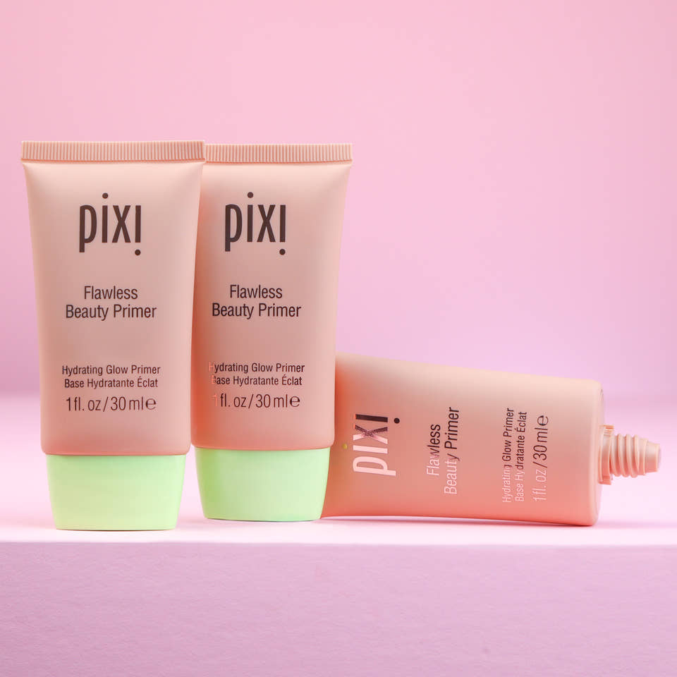 Three tubes of Pixi Flawless Beauty Primer on a pink background view 2