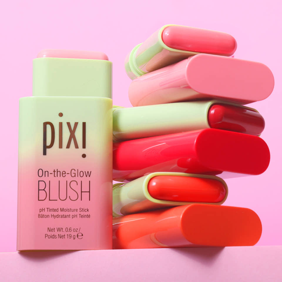 Pixi On-the-Glow Blush sticks in assorted colors against a pink background view 2