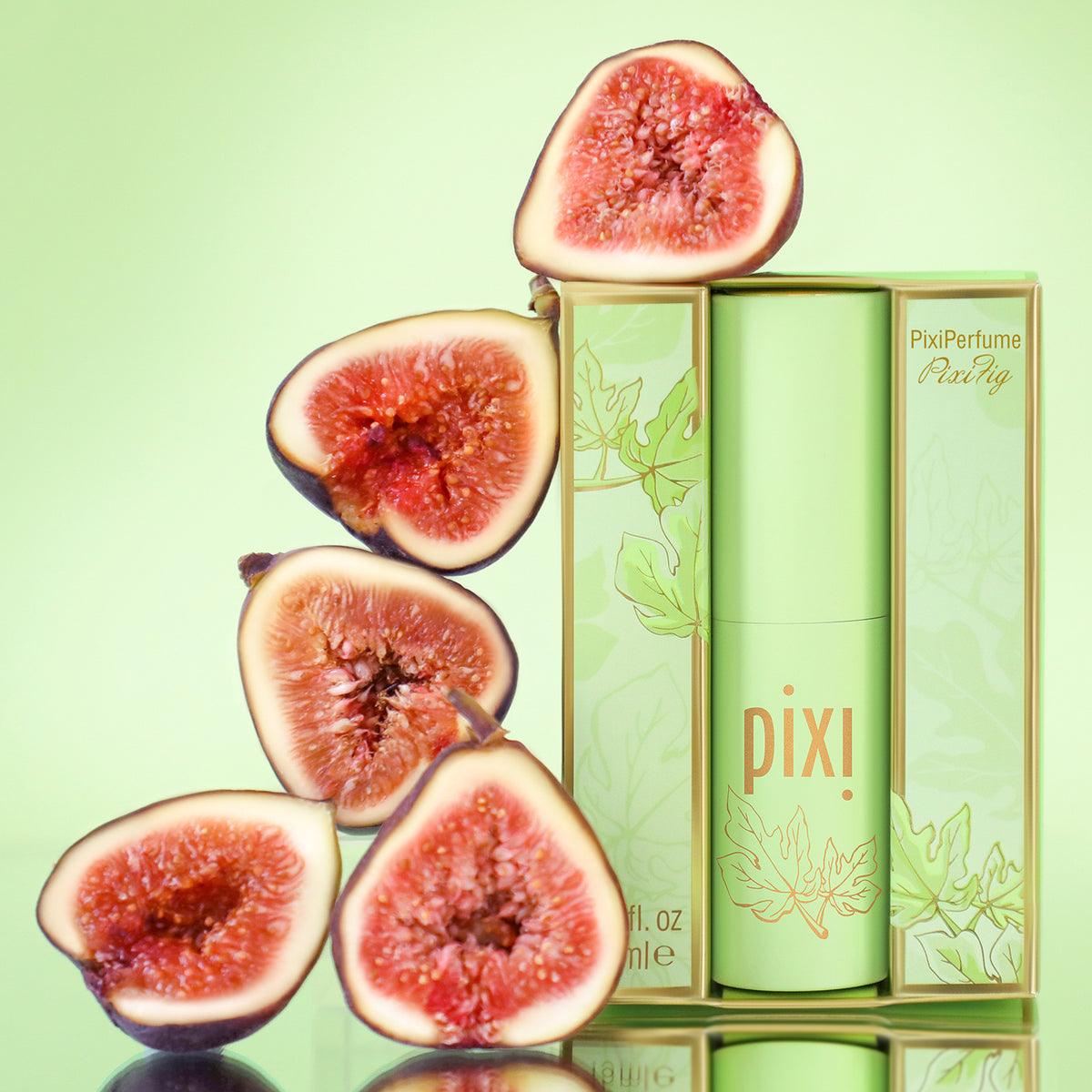Pixi perfume bottle with sliced figs on a green background