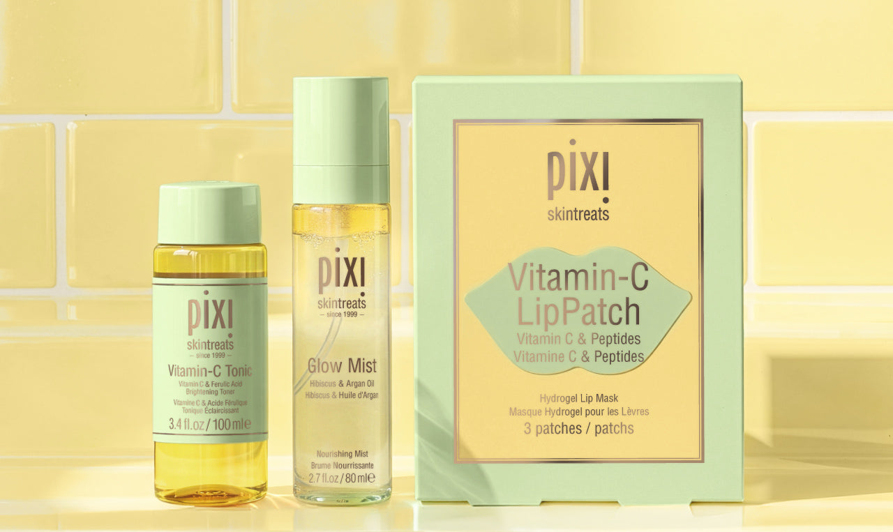 Featuring Vitamin-C Tonic Travel Size, Glow Mist, and Vitamin-C LipPatches (set of 3) on a yellow tiled background - view 2