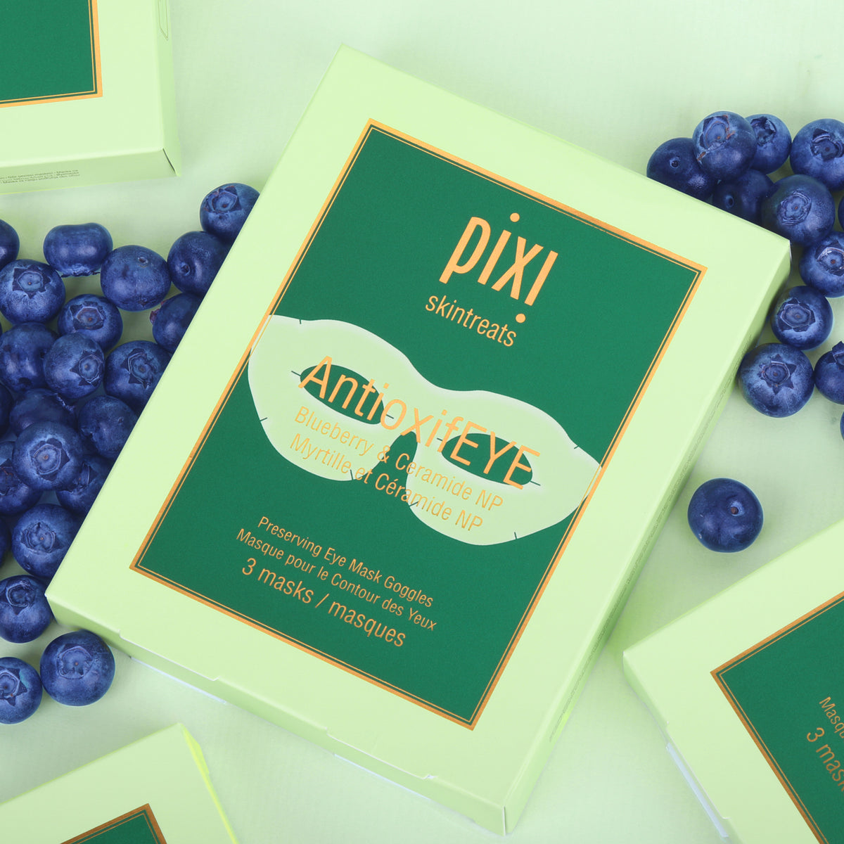 PIXI Skintreats AntioxifEye mask packaging with blueberries on a light green background