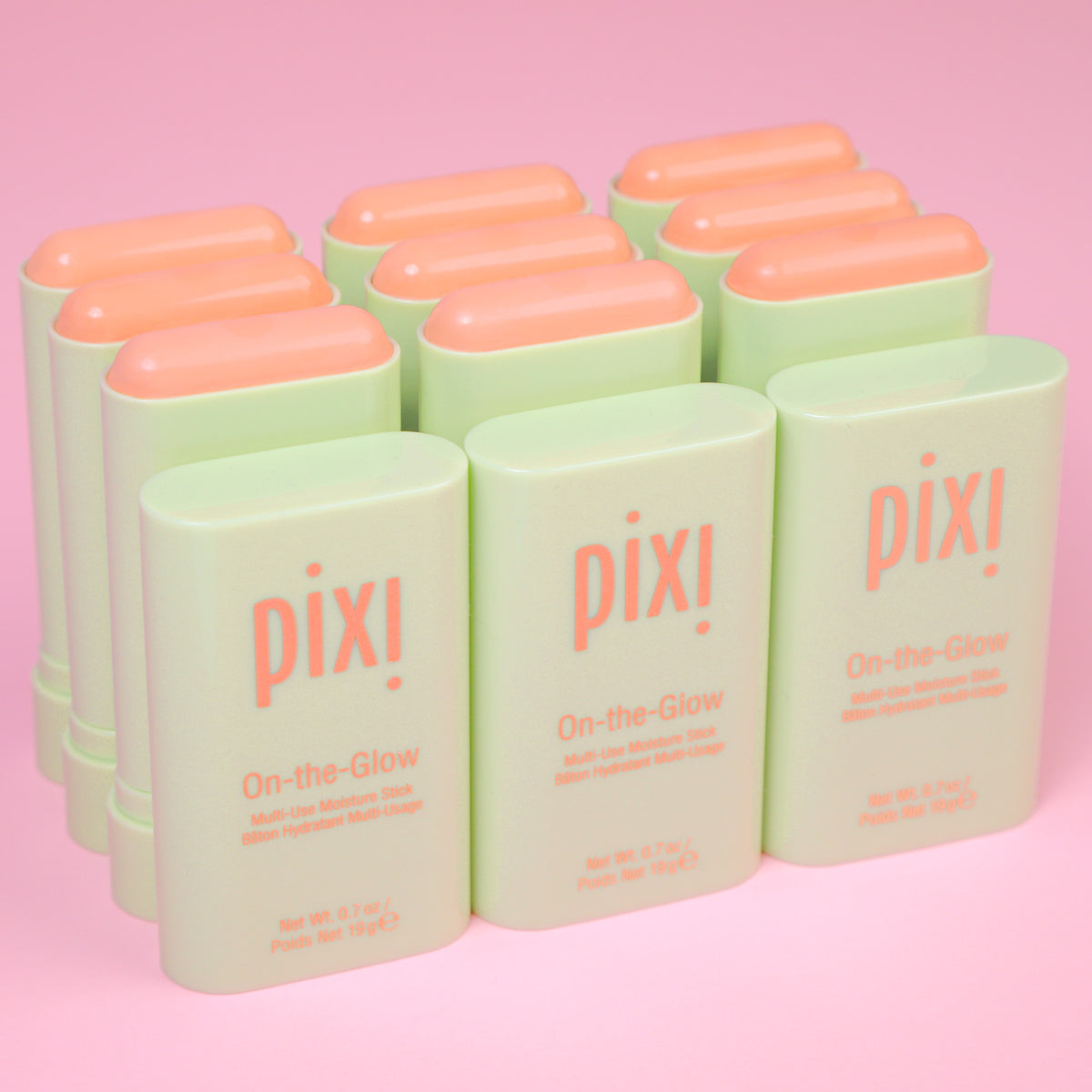 On-the-Glow Moisture Stick multiple in a row on pick background.