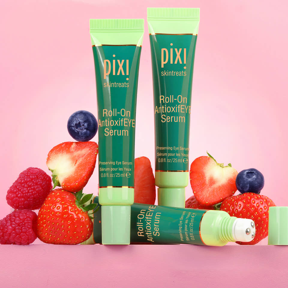 Roll-on AntioxifEYE Serum - three products with antioxidant rich fruit in background of image. view 1