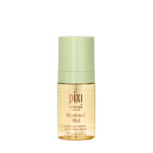 Pixi SkinTreats Vitamin-C Mist in a clear cylindrical bottle showing the golden formula inside, topped with a light sage green cap, on a solid white background. view 1