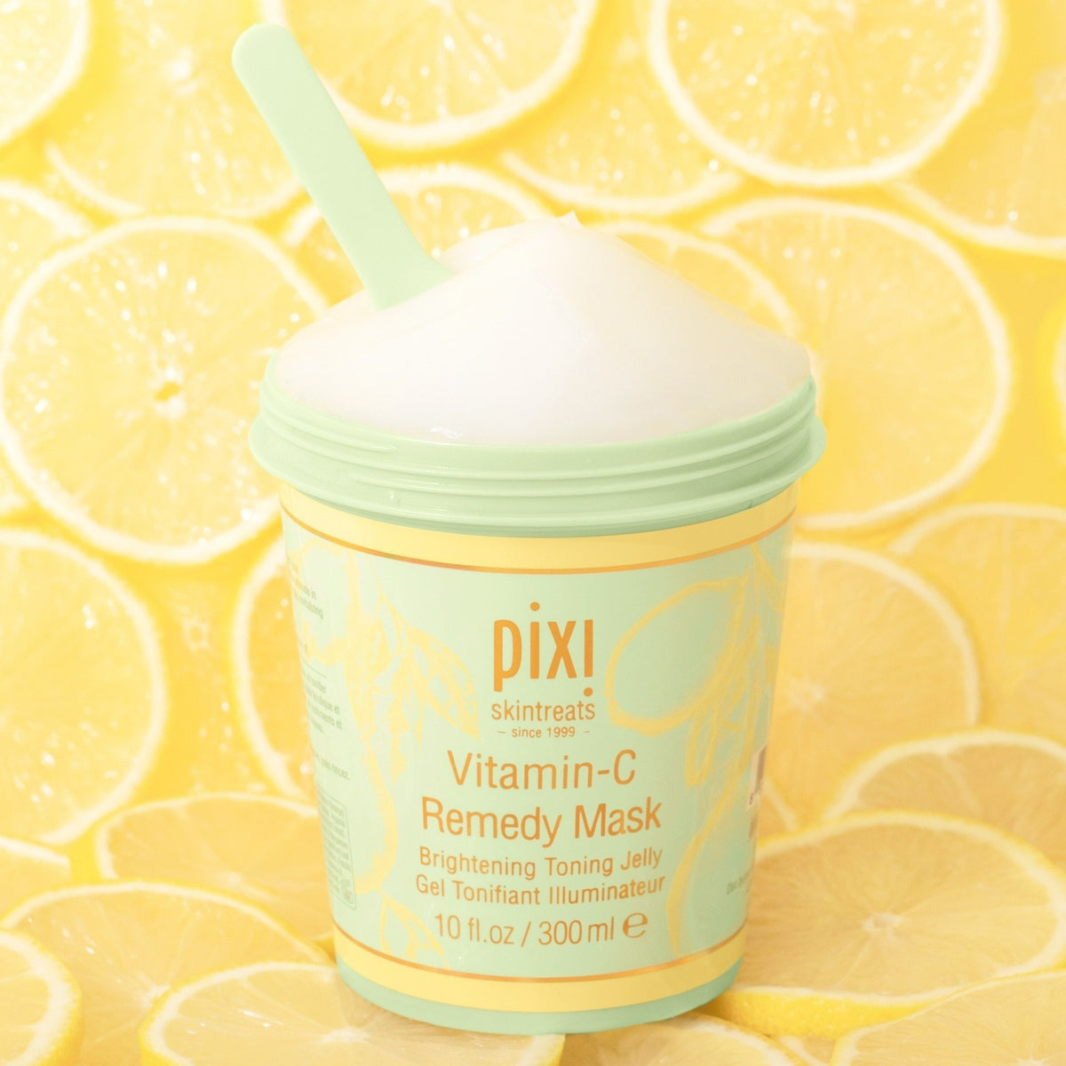 Vitamin-C Remedy Mask with lemon ingredients in the background.
